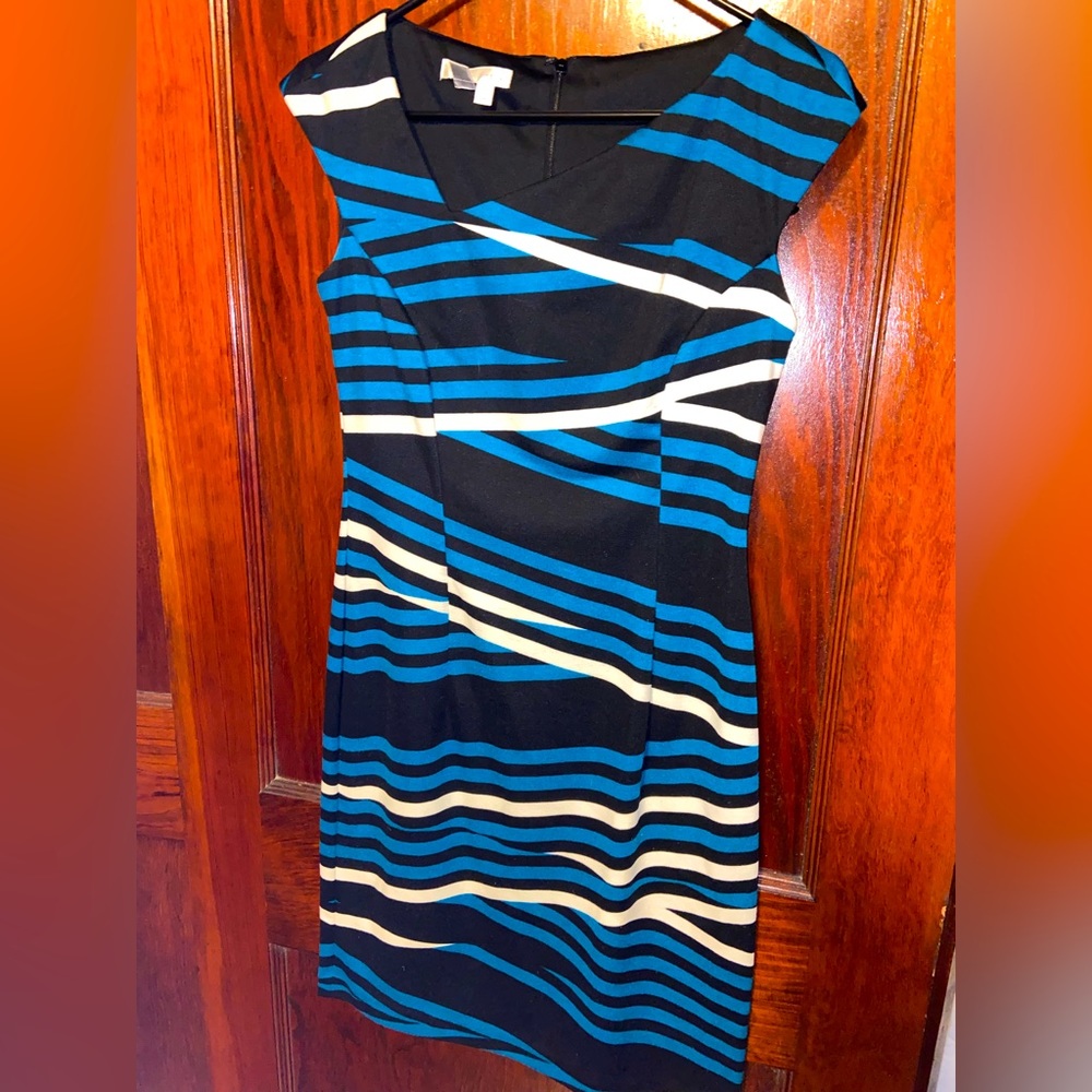 Asymmetrical neck line, blue, black and white dress